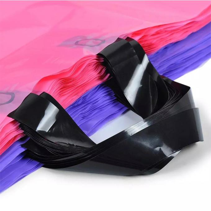 El rosa grande de la mercancía y el regalo plástico grueso púrpura del PVC empaqueta bolsos de compras al por menor de la ropa