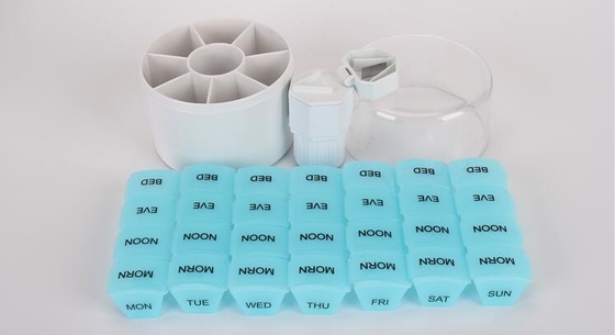 caja de almacenamiento plástica de la píldora de la forma de la columna de 28 compartimientos con la caja del agolpamiento de la píldora, trav plástico respetuoso del medio ambiente convencional de 4 rejillas