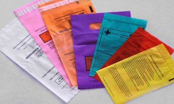 El tipo eliminación de residuos médica de la cerradura de la cremallera del biohazard suministra los bolsos médicos plásticos de la autoclave del LDPE, mar médico del embalaje k